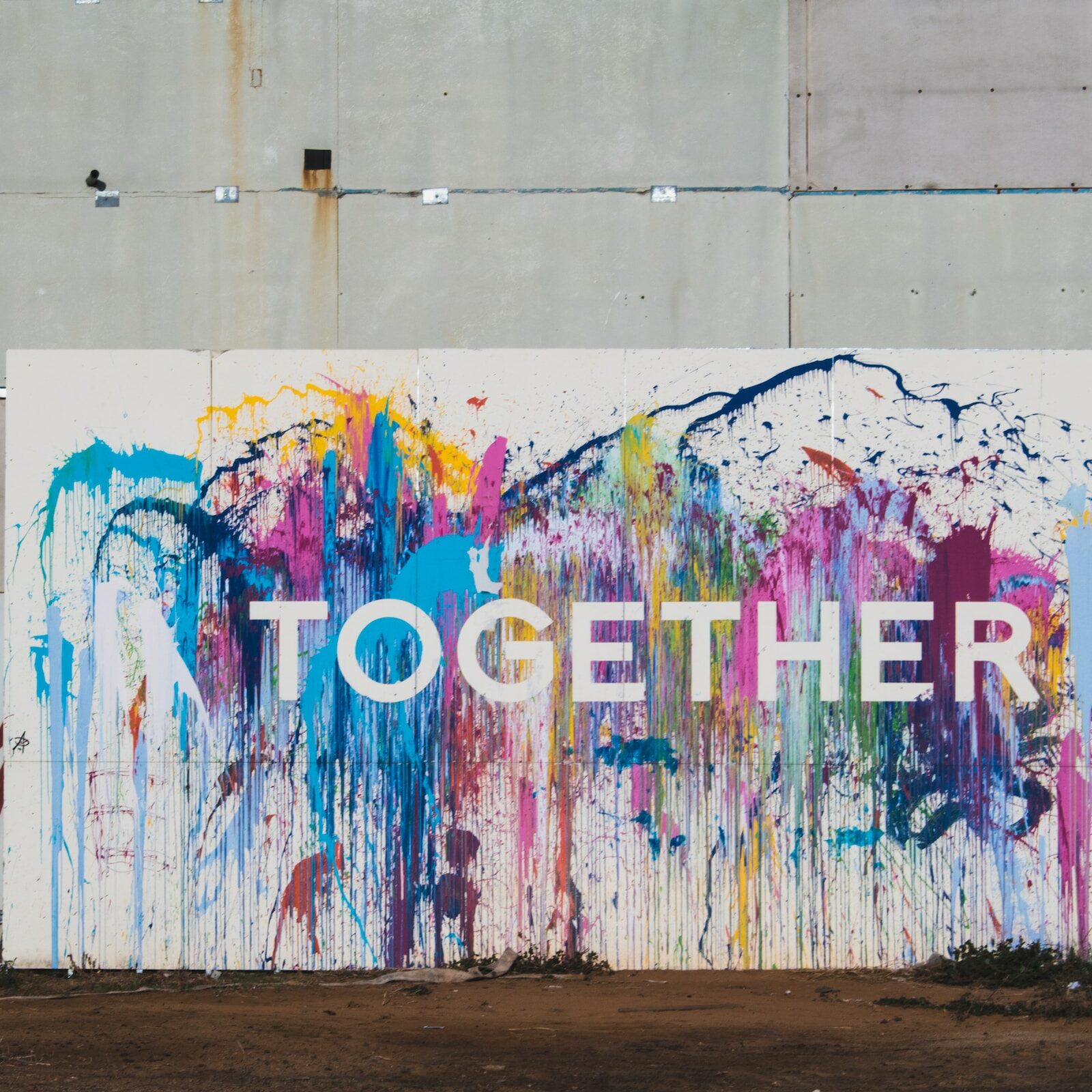 Visual of a colorful wall with "Together" superimposed